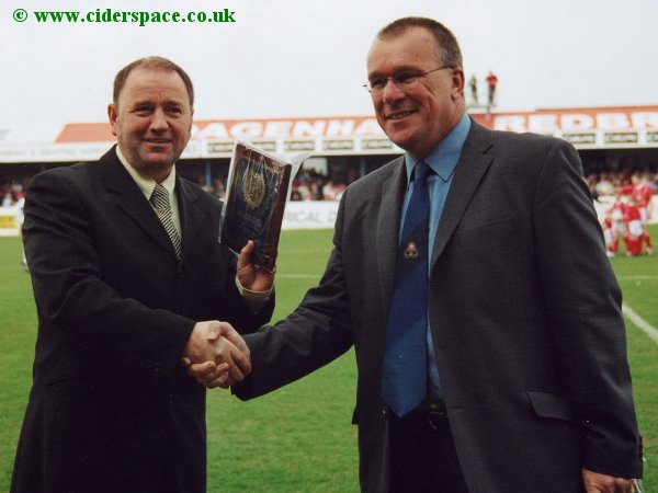 Gary Johnson receives his Manager of the Month plaque from Conference Chief Executive John Moules