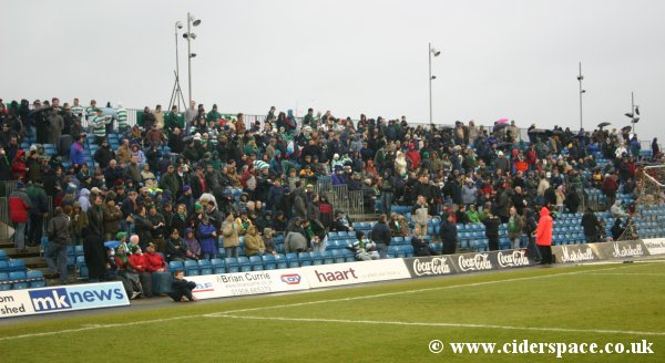 The West Stand - an uncovered stand where things like umbrellas are banned!