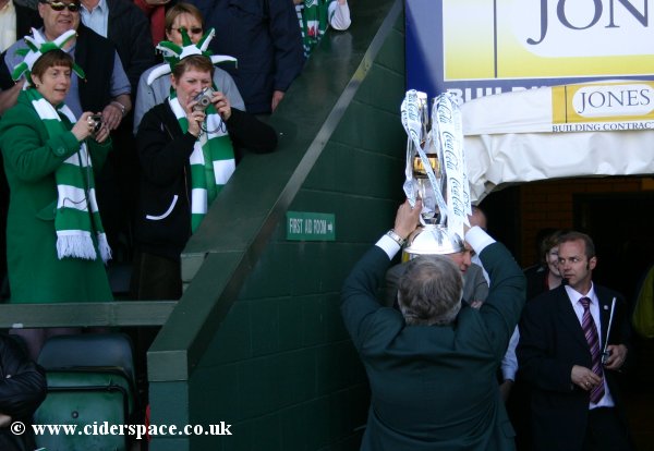 Chairman John Fry brings the League Two trophy out from the players tunnel
