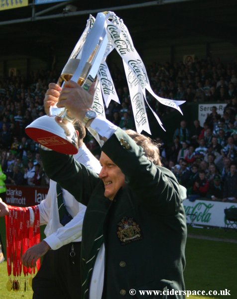 Chairman John Fry continues to walk to take the League Two trophy out onto the pitch